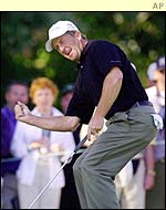 Fred Funk celebrates a successful putt during his third round