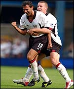 Sylvain Legwinski celebrates the fourth goal with Sean Davis