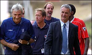 Curbishley (centre) looks less happy than Ranieri (right) as they leave the pitch