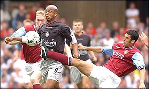 Mark Delaney makes a challenge on Diouf