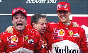 Rubens Barrichello, Ferrari sporting director Jean Todt and Michael Schumacher on the podium at the Hungarian Grand Prix