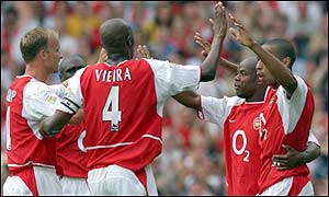 Arsenal's Sylvain Wiltord runs unchallenged through the Birmingham defence to score one of the early goals of the season