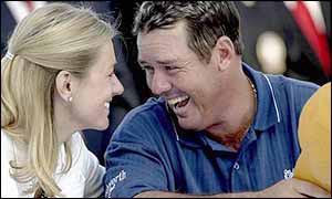 Rich Beem laughs with his wife after winning the USPGA