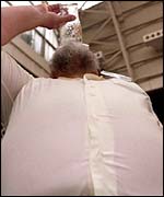 Beer drinker downing pint