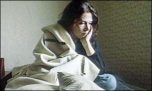 Woman in bed and breakfast