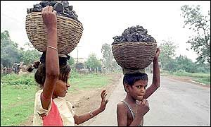 Indian children carrying coal