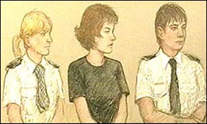 Maxine Carr, flanked by policewomen 