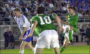 Robbie Keane looks on as Colin Healy hits Ireland's second goal
