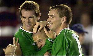 Kevin Kilbane, Graham Barrett and Colin Healy celebrate Ireland's third goal
