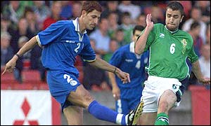 Northern Ireland's Damien Johnson (right) and Cyprus defender Petros Fon in action at Windsor Park