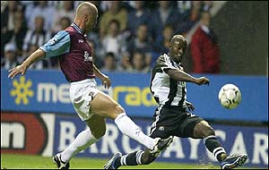 Newcastle striker Lomana LuaLua takes on Thomas Repka of West Ham at St James' Park