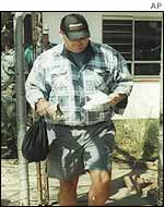 White farmer outside courthouse