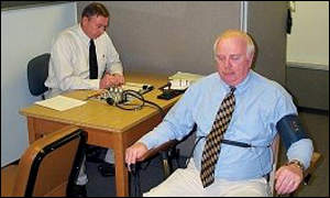 Virginia state police official administering polygraph test