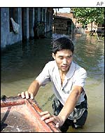 Man pushing boat