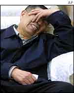 Weeping relative of victim of China Northern crash