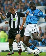 Newcastle's Kieron Dyer tackles Manchester City's Marc-Vivien Foe