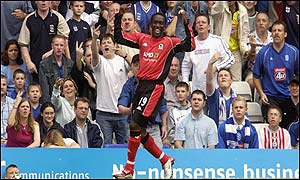 Dwight Yorke celebrates scoring for Blackburn