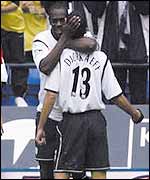 Michael Ricketts congratulates Youri Djorkaeff after he put Bolton in the lead
