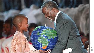 President Mbeki, right, is presented with a globe by a boy from the next generation