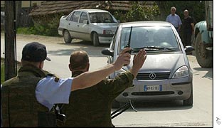 Macedonian police officers direct the traffic near the attack site