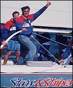 Dennis Conner celebrates victory on Stars and Stripes