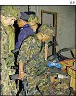 Soldiers at the site of a bomb explosion in the capital