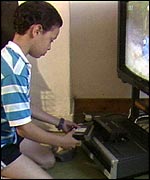 Child using VHS video recorder