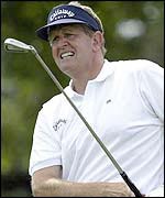 Colin Montgomerie anxiously watches a shot