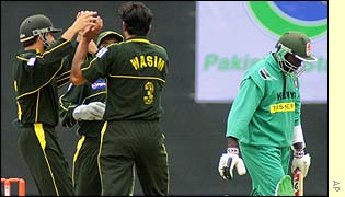 Wasim celebrates the wicket of Thomas Odoyo