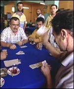 Card players in coffee house
