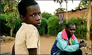 Man and child near Livingstone town, Zambia (Photo: IFRC)