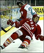Paxton Schulte (white) of Belfast sends Patrik Windback of Troja Ljungby flying