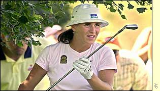 France's Patricia Meunier-Lebouc prepares to play out of the rough on the third hole