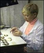 Artist works on Putin pocket watch