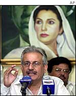 Pakistan Peoples Party Secretary General Raza Rabbani with picture of Benazir behind