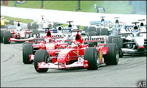 The race gets off to a clean start with pole-sitter Michael Schumacher blasting his way off the grid, maintaining first place