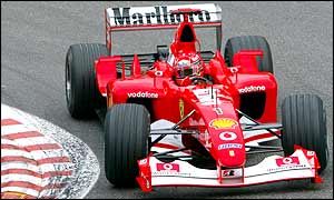 Schumacher extends his lead from Ferrari team mate Rubens Barrichello as he runs away with the Begian GP
