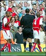 Referee Andy D'Urso hands Patrick Vieira a red card