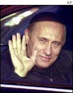 Putin waves from his car