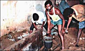 Dalits clearing excreta by hand during the night
