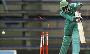 David Obuya of Kenya is bowled for a duck by Glenn McGrath 