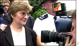 Marjorie Evans faces press photographers