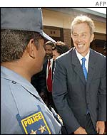 Tony Blair chats with police