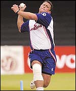 Darren Gough bowls in the nets with his right knee heavily bandaged 