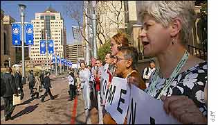 Women protest outside summit venue