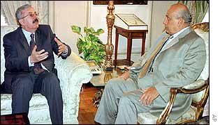 Iraqi Foreign Minister Naji Sabri (left) talks to his Egyptian counterpart Ahmed Maher in Cairo on Tuesday