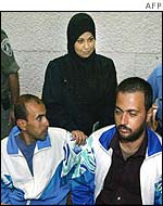 Kifah Ajouri (l), Intisar Ajouri (c) and Abdel Nasser Assidi, freed, (r) in court