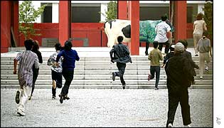North Koreans run towards school