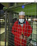 Mehdi Ghazali in his cage in Sergels Torg square in central Stockholm