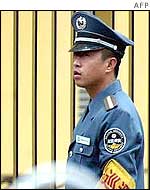 Chinese police officer outside school
